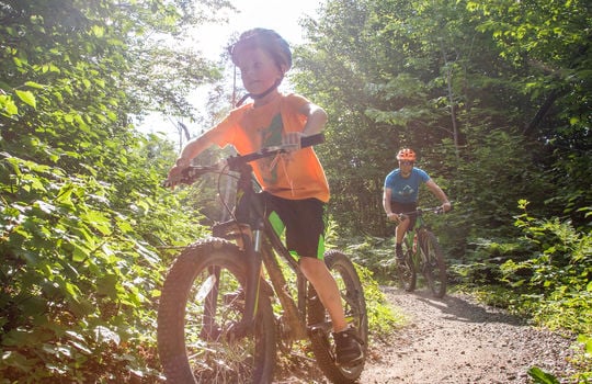 kid on a mountain bike
