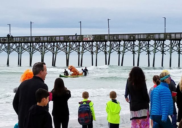 Paddleboard Dinosaur at Dolphin Dip in Surf City NC
