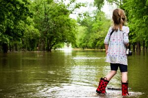 Girl Standing in Flood Waters