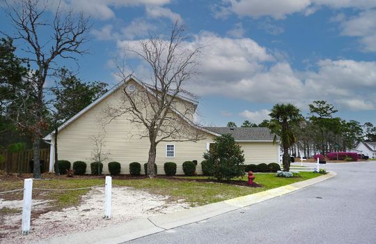 Example townhome in Winds Ridge. Cream colored vinyl siding and black and white mailboxes