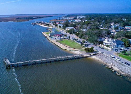 Aerial view of the town of Southport NC pier. Looking over the cape fear river at the city water front.