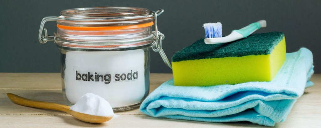 Baking Soda and Cleaning Tools sitting on a table or counter.