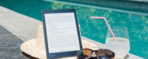 E-Reader and Drink by Swimming Pool