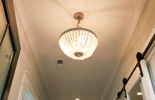 The seaglass foyer light in a luxury home in Waterstone.