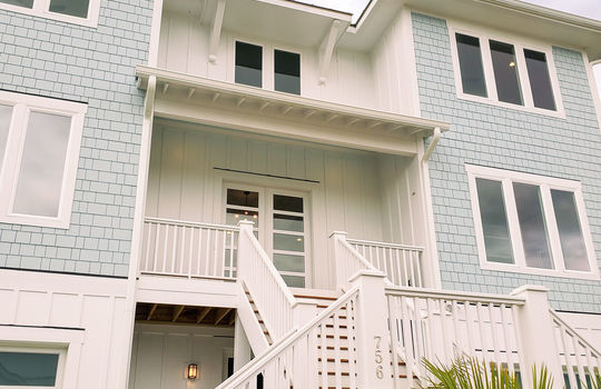 A split staircase leads up to the second-floor main entrance of 756 Waterstone Drive.