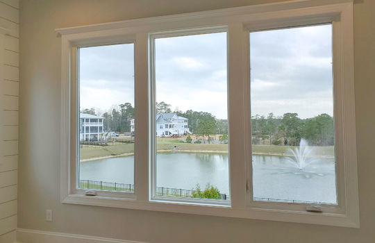 A view of the large pond through a set of windows.