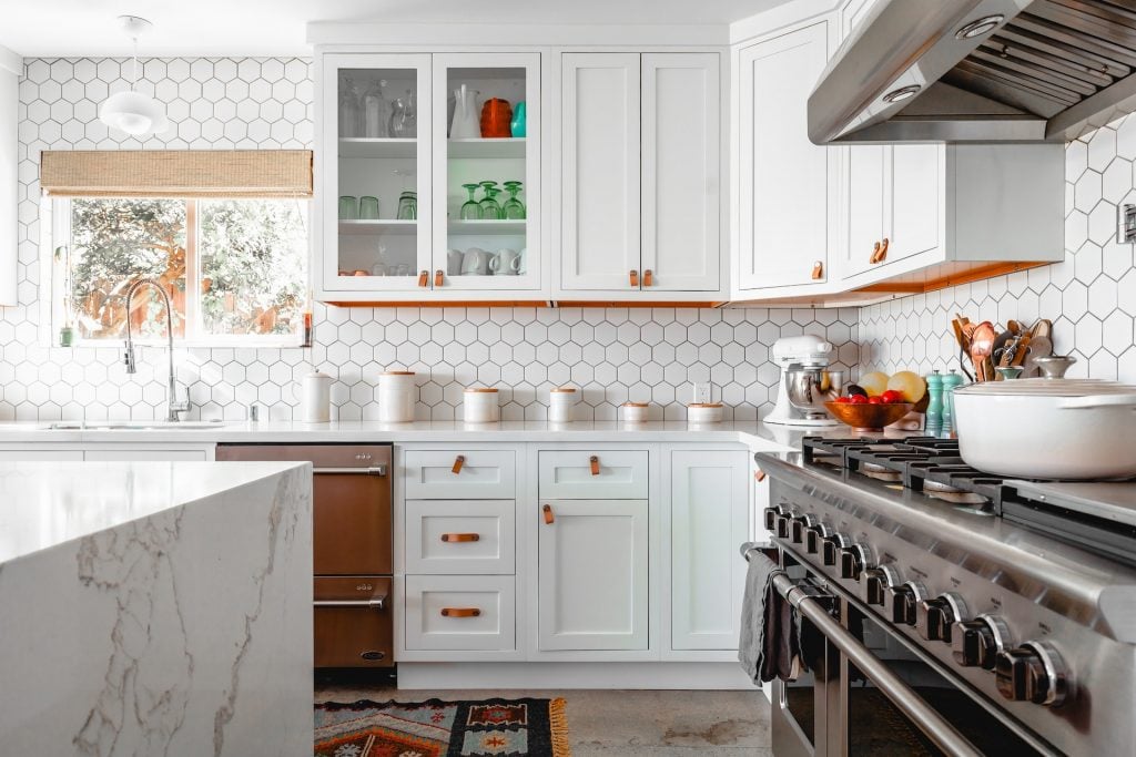 Modern kitchen with white cabinets.