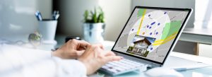 Woman searching for house on computer