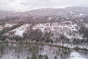 Aerial view of Peaks Village covered in snow
