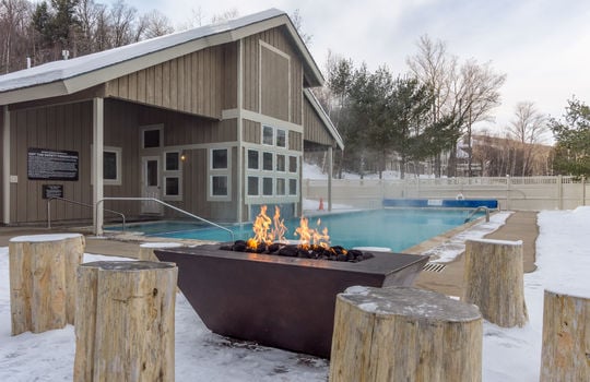Heated outdoor pool and firepit at Locke Mountain Townhomes