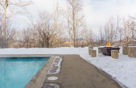 Heated outdoor pool and firepit at Locke Mountain Townhomes
