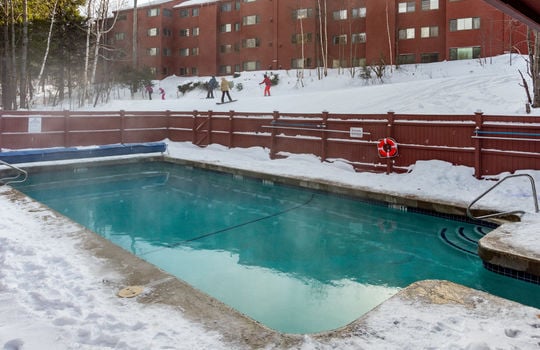 Heated outdoor pool at North Peak Condo