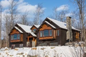 Mountain home on snowy lot