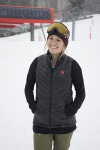 Smiling woman in Sunday River vest