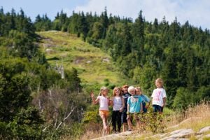 Smiling kids hiking at Sunday River