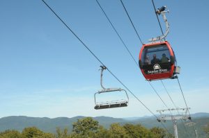 Friends riding the Chondola in summer