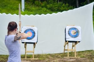 Girl taking archery course with Sunday River Outfitters