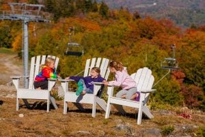 Kids Sitting in Adirondack Chairs